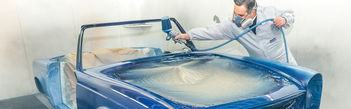 Paint spraying in booth